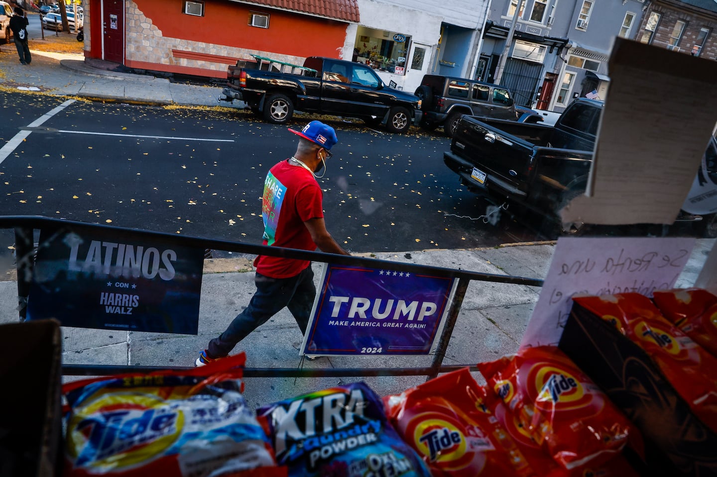 Campaign signs for both Trump and Democratic candidates were outside a Dominican-owned bodega in Reading, Pa.