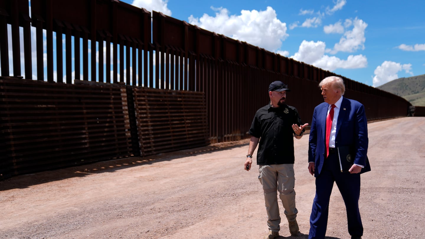 President-elect Donald Trump spoke to Paul Perez, president of the National Border Patrol Council, as he toured the southern border with Mexico on Aug. 22 in Sierra Vista, Ariz., during his campaign.