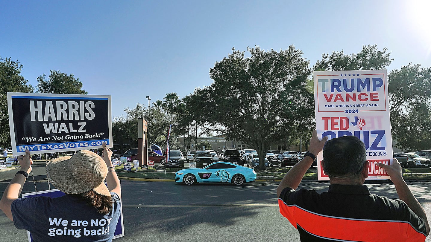 Supporters of Kamala Harris and Donald Trump campaigned outside a polling place in McAllen, Texas, on Nov. 5.