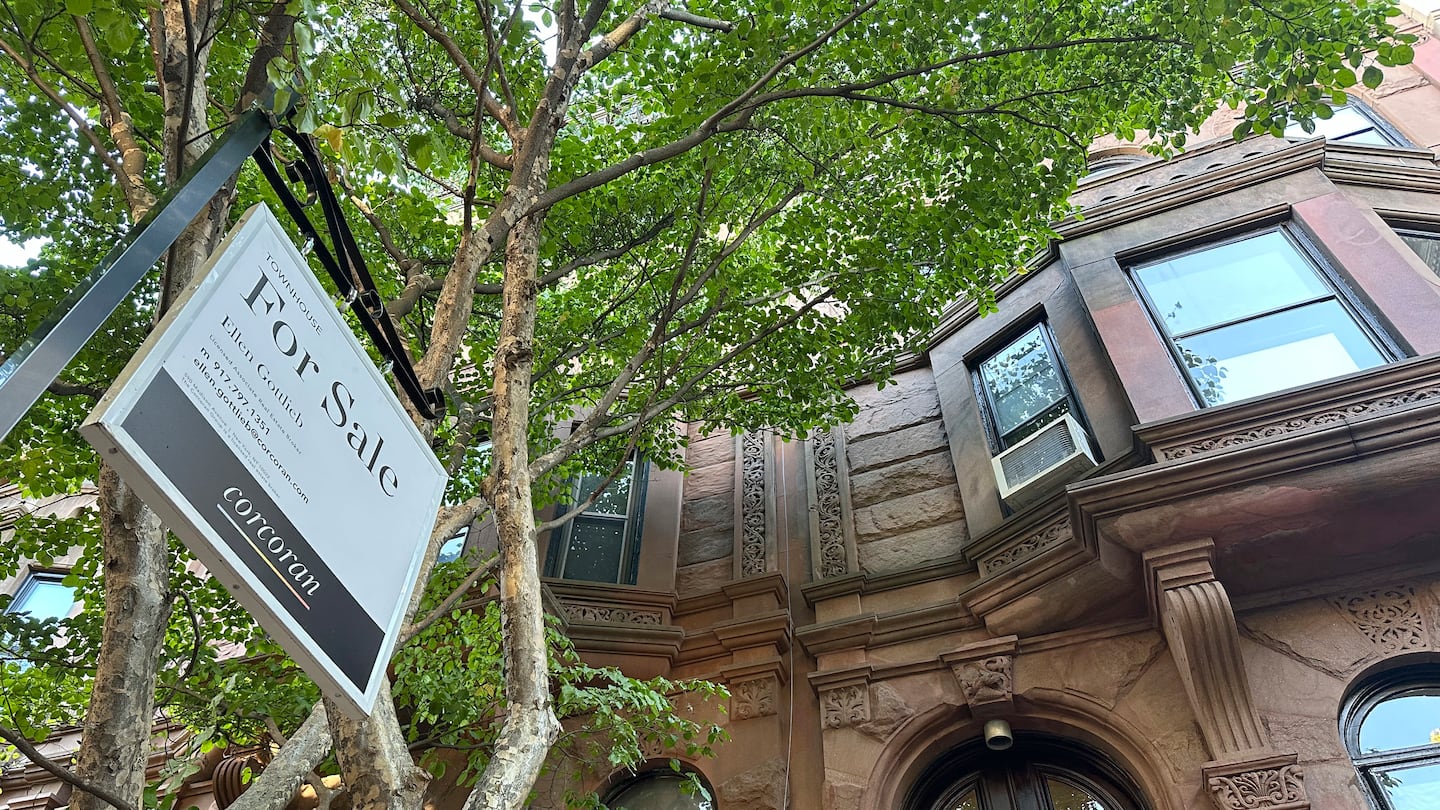 A "for sale" sign hung in front of a home in the Park Slope neighborhood in the borough of Brooklyn in New York on Oct. 10.