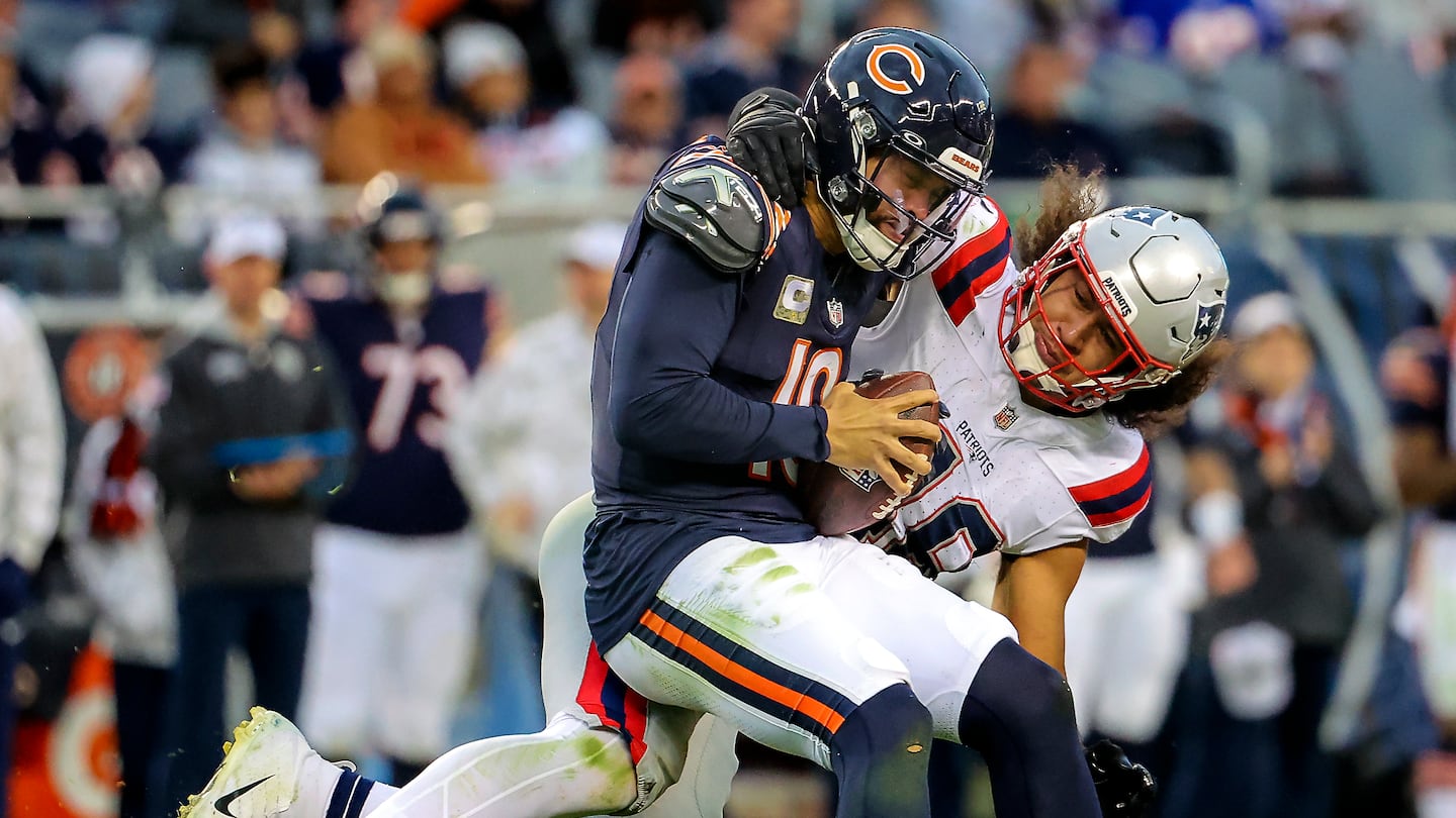 The Patriots' Jahlani Tavai took down Bears quarterback Caleb Williams in the fourth quarter, one of New England's nine sacks in the win.