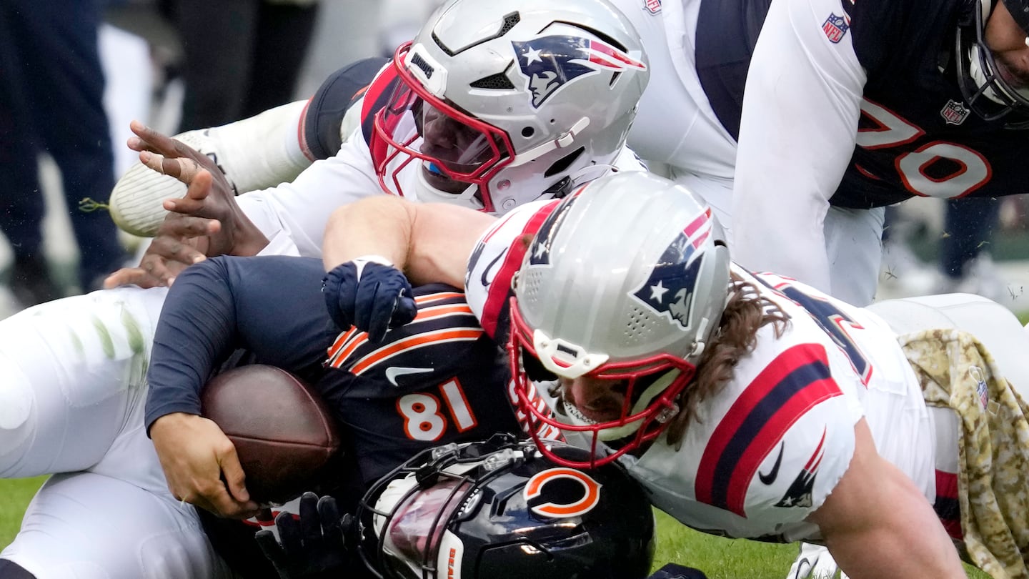 Brenden Schooler (right) got in some defensive snaps and sacked Bears quarterback Caleb Williams.