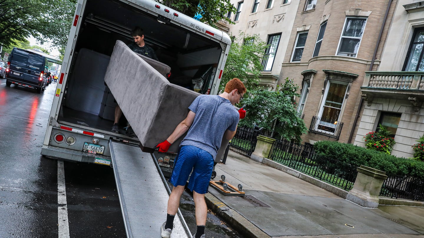 A move-in day in Boston in 2021. A new study by psychologists finds that the countries where people are likeliest to change residences tend to be happier.