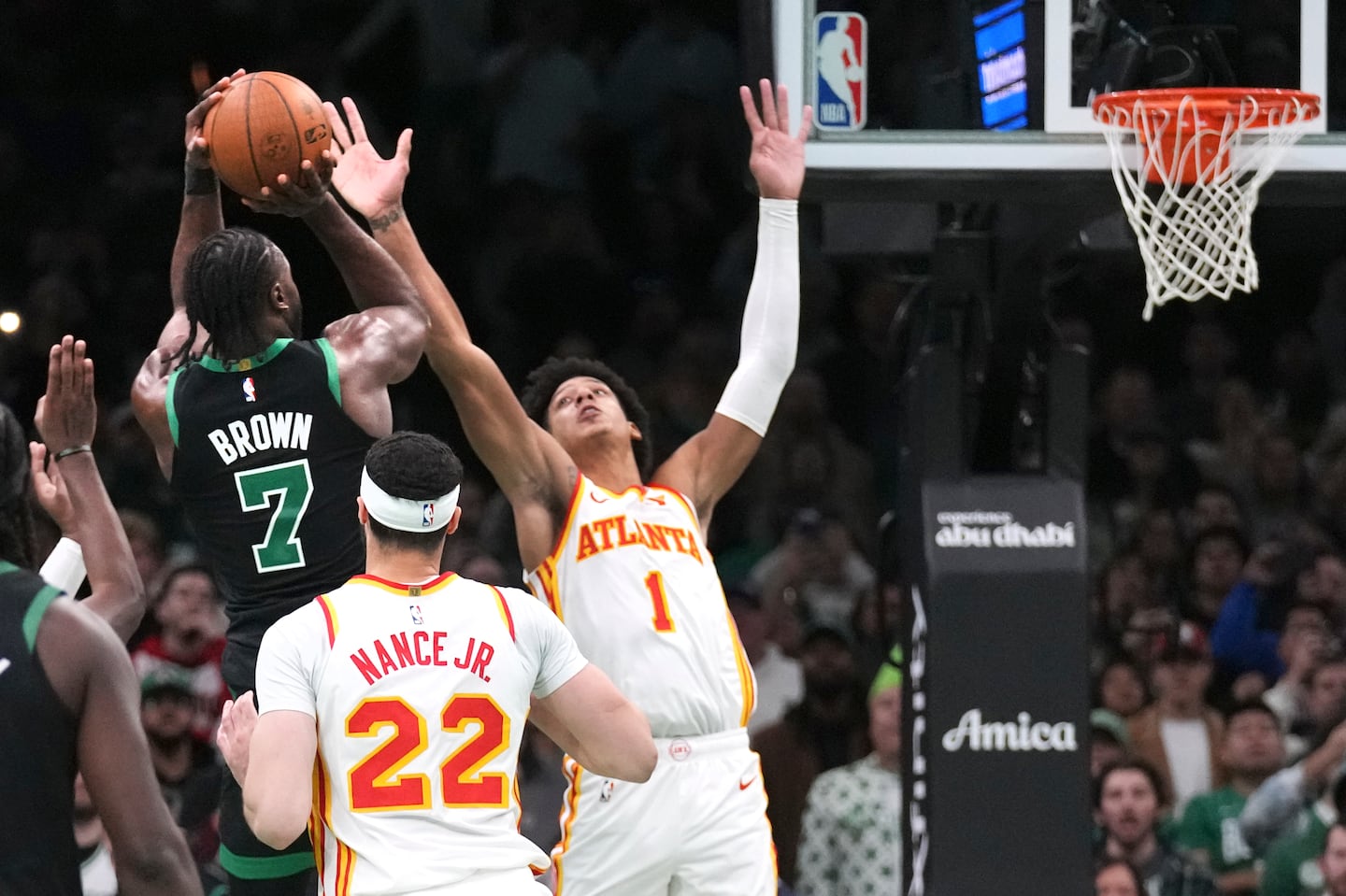 Tough defense by the Hawks' Jalen Johnson (1) on Jaylen Brown in the final seconds led to the Hawks holding off the Celtics, 117-116, at TD Garden in the opening game of the NBA Cup.