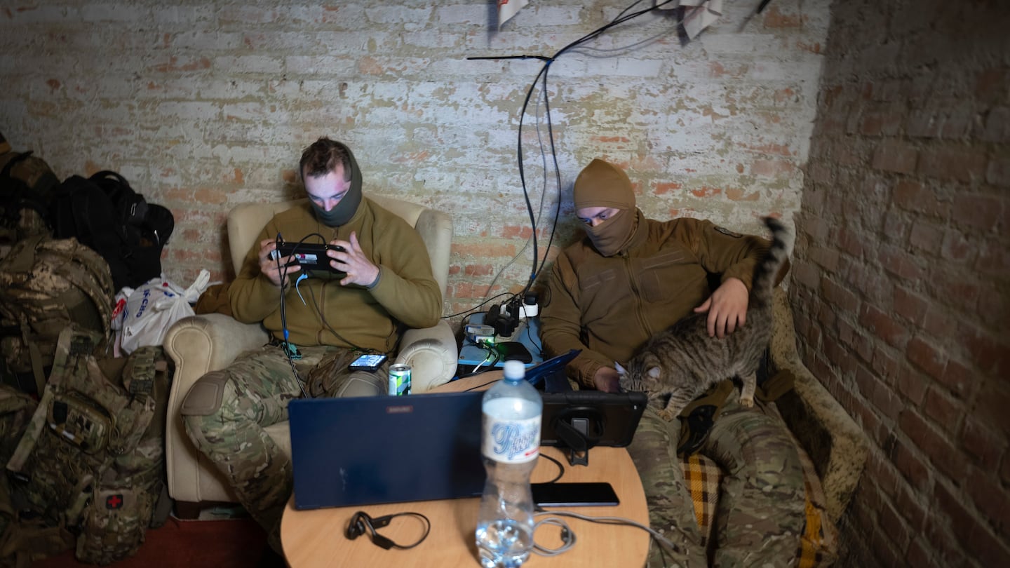 Servicemen of Ukraine's Khartia brigade pilot drones in a shelter on the frontline near Kharkiv, Ukraine, late Thursday, Nov. 7, 2024. (AP Photo/Efrem Lukatsky)