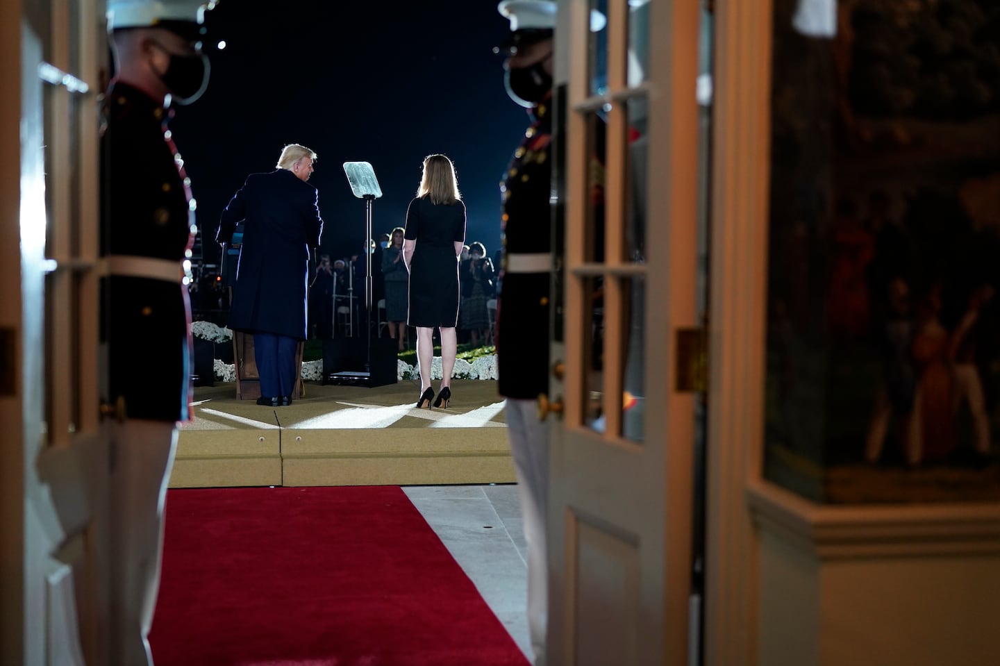 Donald Trump looked at Supreme Court Justice Amy Coney Barrett during her swearing-in ceremony at the White House on Oct. 26, 2020.