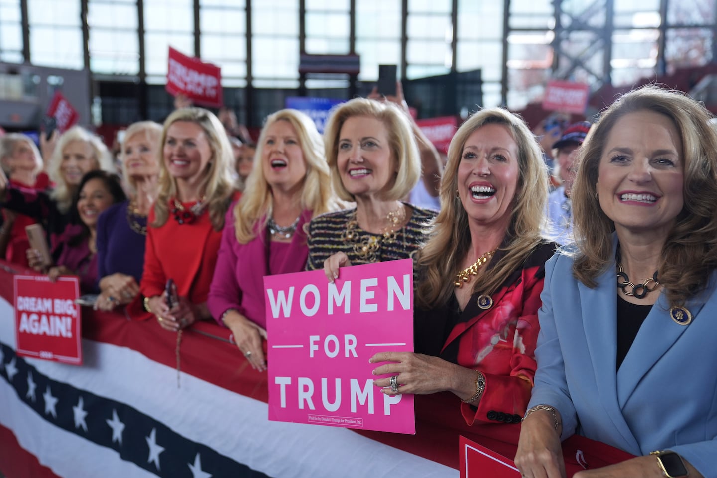 Donald Trump supporters smiled as he arrived to speak during a campaign rally at J.S. Dorton Arena, on Nov. 4, in Raleigh, N.C.