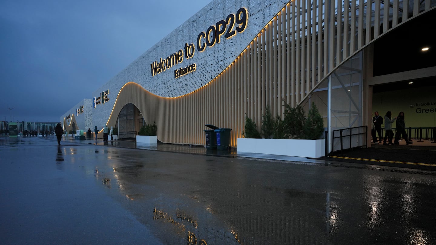 Attendees arrive for the day at the COP29 U.N. Climate Summit, Thursday, Nov. 14, 2024, in Baku, Azerbaijan. (AP Photo/Peter Dejong)