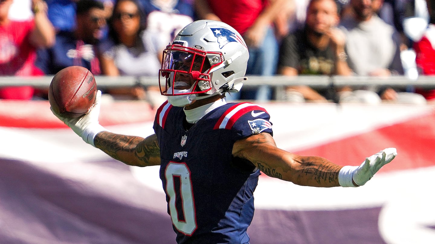 Patriots cornerback Christian Gonzalez (0) had this interception in the first matchup against the Dolphins back on Oct. 6 in Foxborough. Could the rematch in Miami be a strong shot at a New England victory?