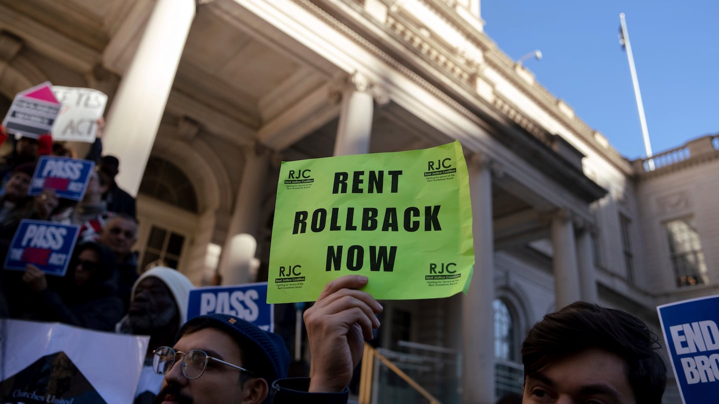 People gather outside of City Hall for a rally in support of the FARE Act ahead of a City Council meeting, Wednesday, Nov. 13, 2024, in New York. 