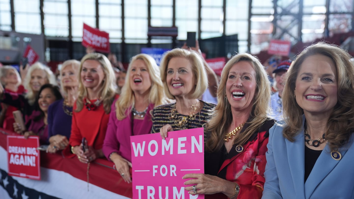 Donald Trump supporters smiled as he arrived to speak during a campaign rally at J.S. Dorton Arena, on Nov. 4, in Raleigh, N.C.