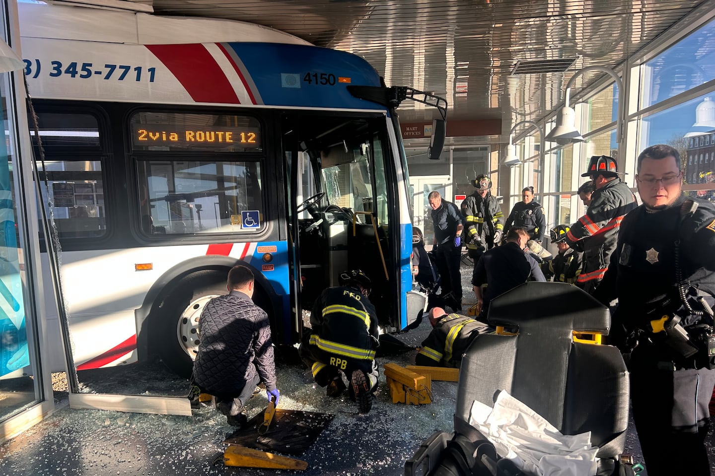 First responders helped rescue a man pinned under a bus at the Montachusett Regional Transit Authority Intermodal Center in Fitchburg.