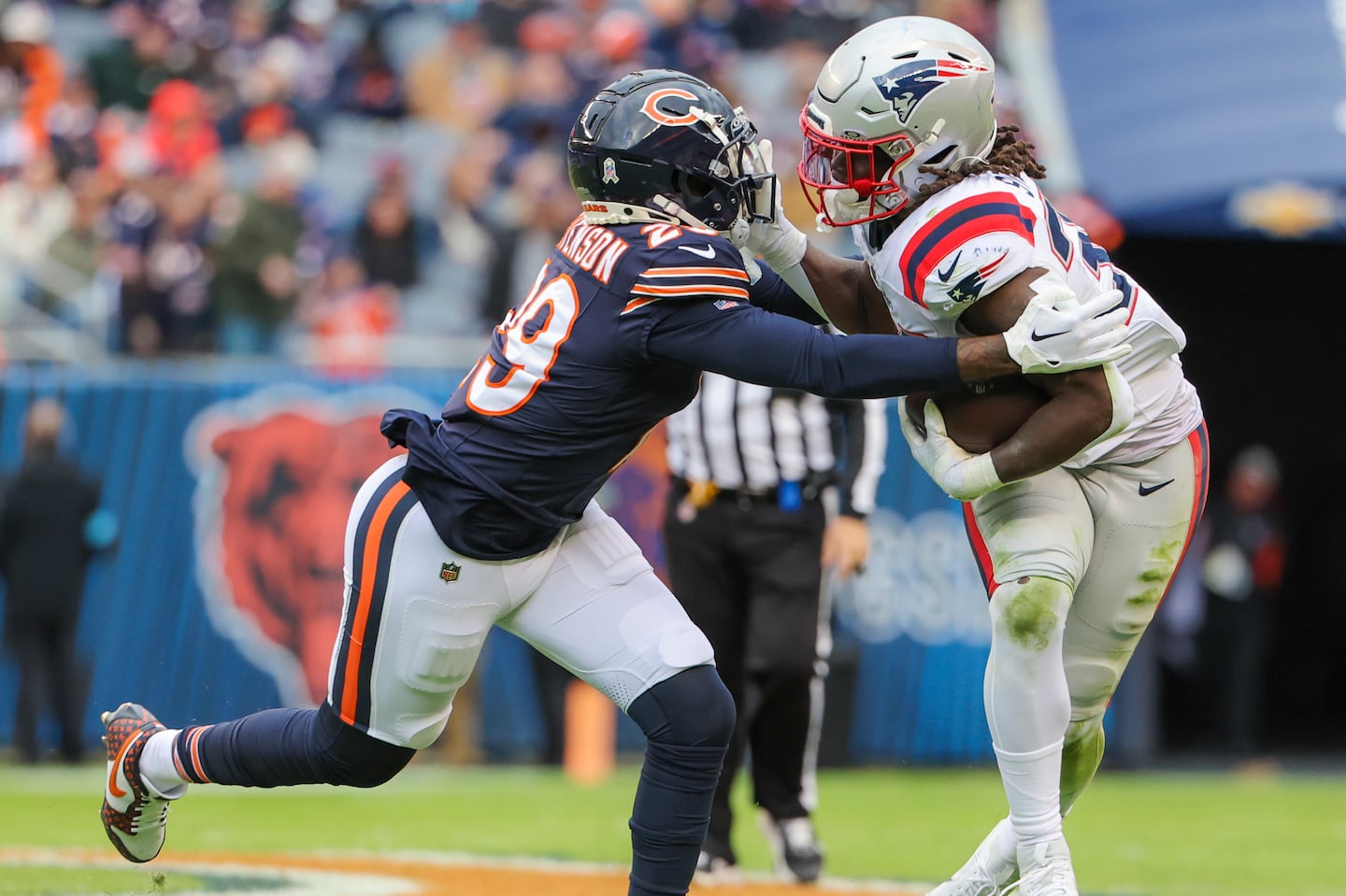 Rhamondre Stevenson (right) was back in form, gaining 74 yards on the ground in the win over the Bears.