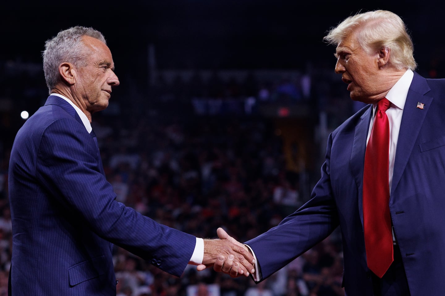 Robert F. Kennedy Jr. and Donald Trump greeted each other during a campaign event in Glendale, Ariz. on Aug. 23.