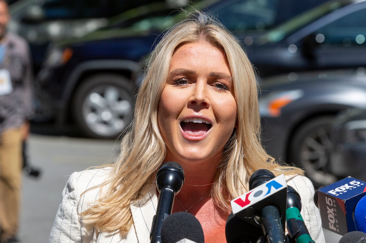 Karoline Leavitt spoke to the news media across the street from Republican presidential nominee former President Donald Trump's criminal trial in New York, May 28, 2024.