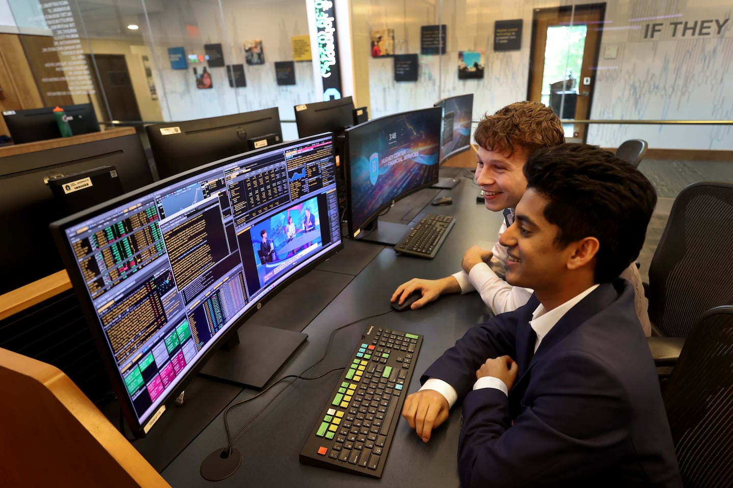 Sai Hejmadi (left) and Adian Swenson, members of the Bentley Investing Group, in the school's trading room.