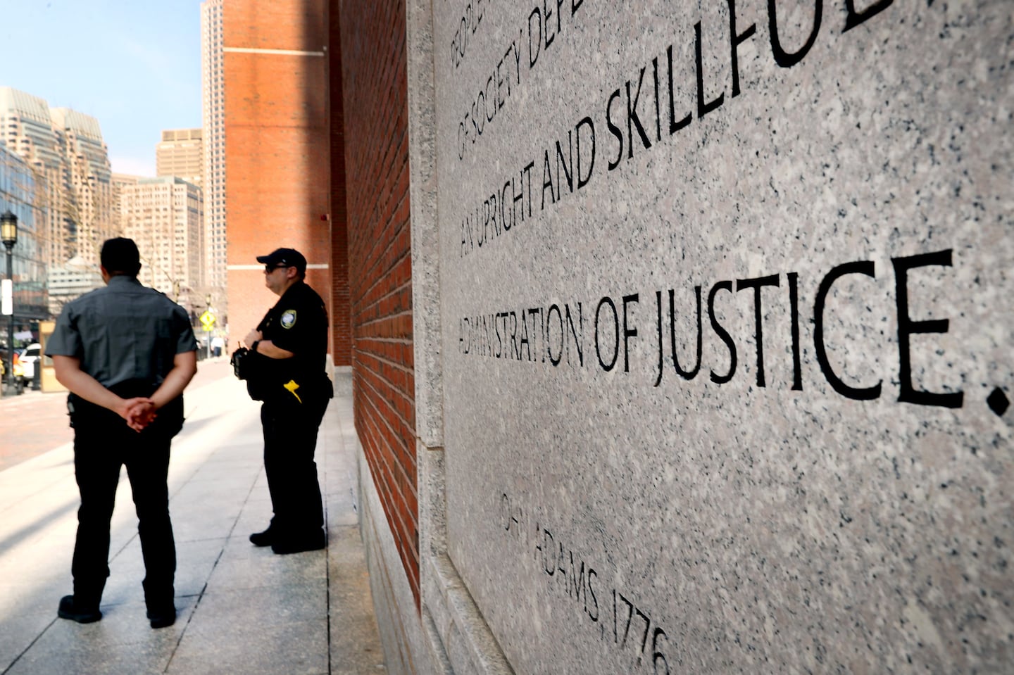 Police stood outside Moakley Federal Courthouse in Boston.