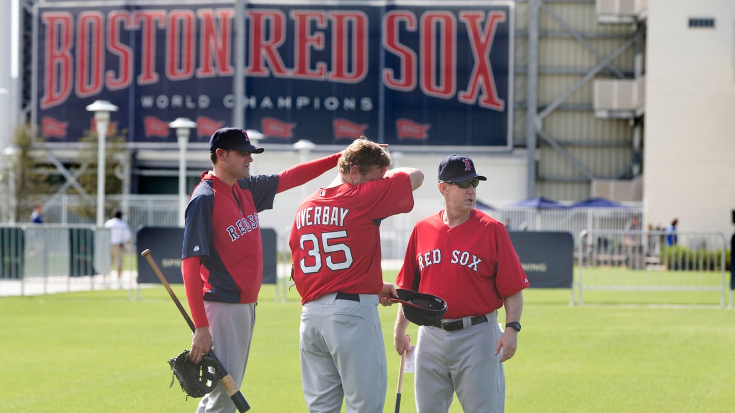 Tom Kotchman (left), player Lyle Overbay (center) and third base coach Brian Butterfield were among those in the Red Sox' spring training camp in 2013.