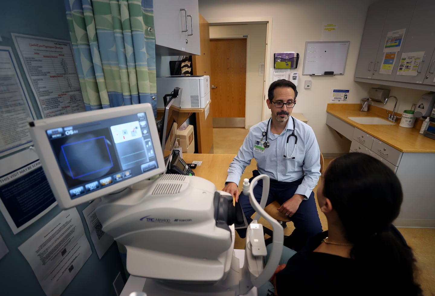 Dr. Asaf Bitton working at BWH South Huntington Primary Care. Bitton is a primary care doctor and associate professor of medicine and health care policy at Harvard Medical School and the T.H. Chan School of Public Health. He has seen an uptick in interest among his peers to join concierge programs, in part because concierge doctors can spend more time with fewer patients.