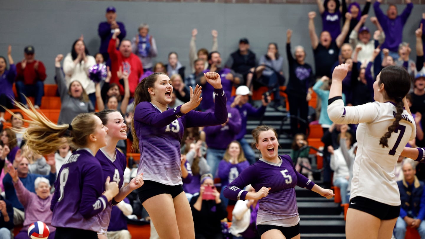 Bourne celebrates its 2024 Division 5 girls' volleyball championship.