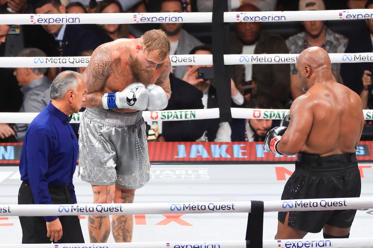 Jake Paul bows to Mike Tyson in the final seconds of their heavyweight bout on Friday night. Paul won by unanimous decision.