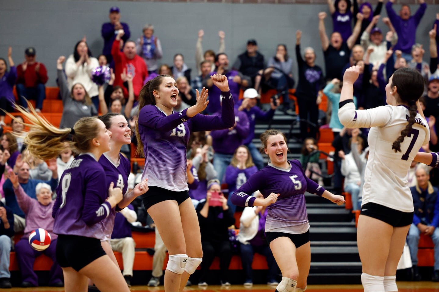 Bourne celebrates its 2024 Division 5 girls' volleyball championship.