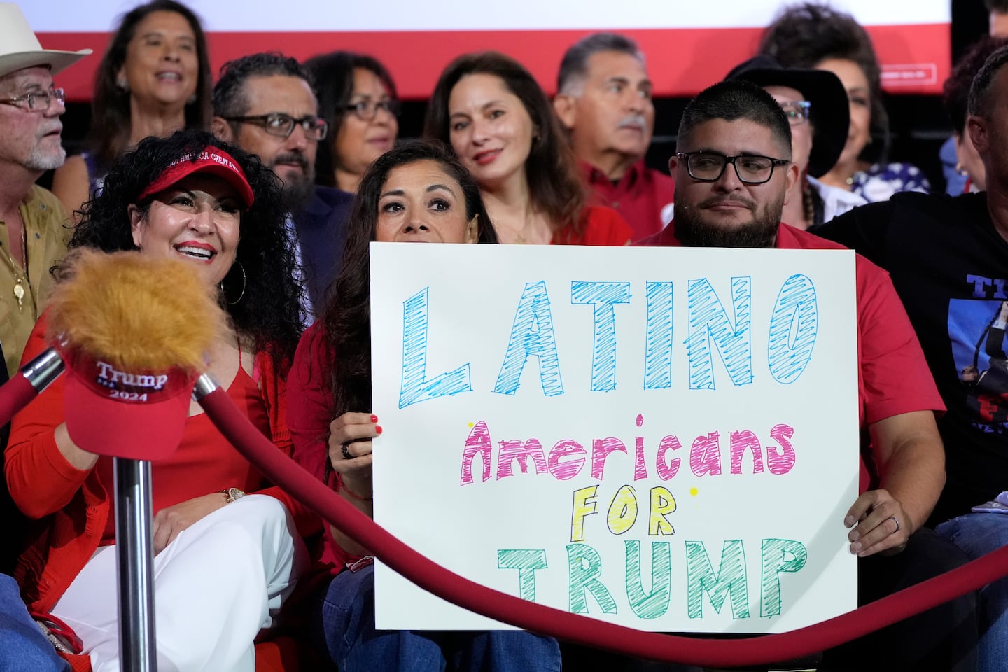 Supporters held a sign before then-Republican presidential nominee Donald Trump spoke during a campaign event Sept.12 in Tucson, Ariz.