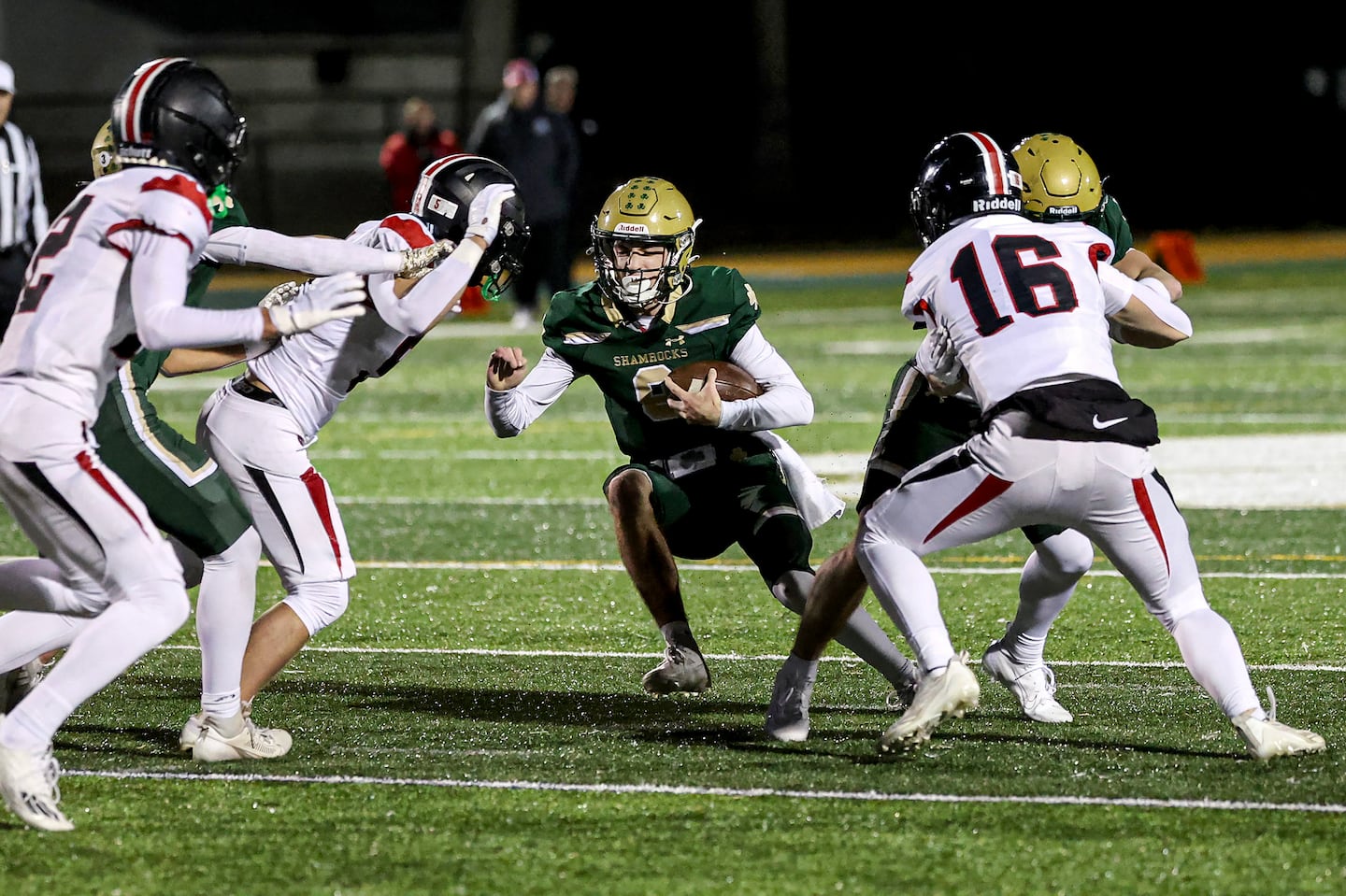 Bishop Feehan quarterback Owen Mordas runs into the Wellesley defense. Wellesley will take on Catholic Memorial in the semifinals.