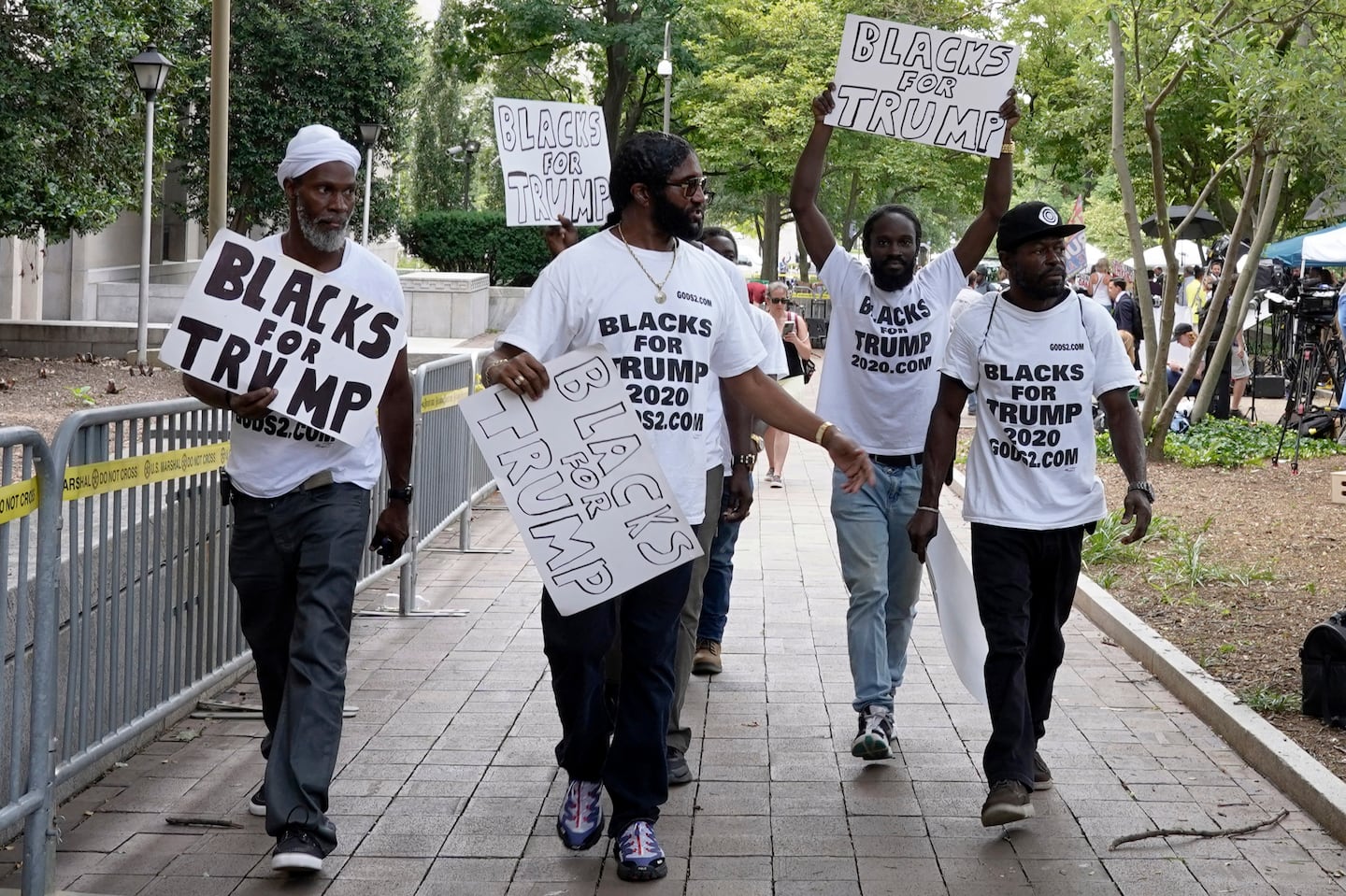 Supporters of Donald Trump with signs and T-shirts that read "Blacks for Trump" marched in Washington D.C. in 2023.