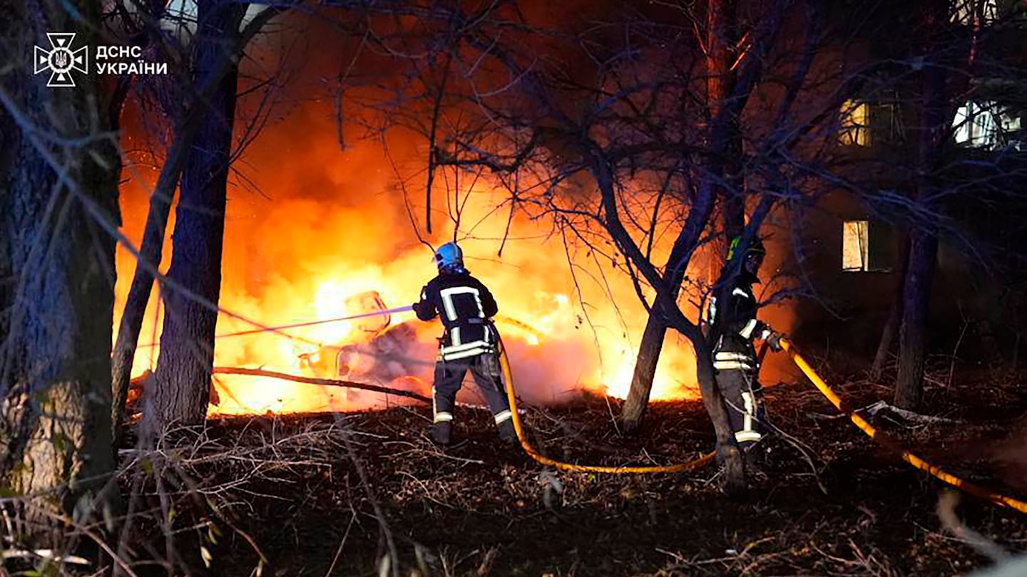 Firefighters extinguish the fire following a Russian rocket attack that hit a multi-storey apartment building in Sumy, Ukraine.