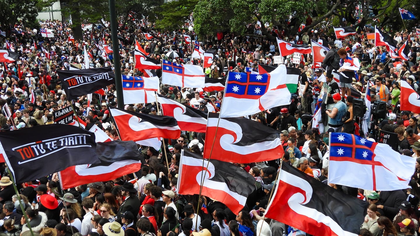 Thousands of people gather outside New Zealand's parliament to protest a proposed law that would redefine the country's founding agreement between Indigenous Māori and the British Crown, in Wellington, on Nov. 19.