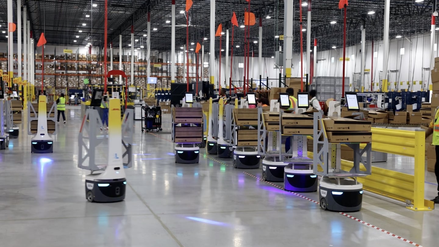 Robots at a DHL facility in Columbus, Ohio, on Oct. 31. Even though robots are starting to take over some repetitive and cumbersome jobs, there are still many tasks they are not good at, making it difficult to know when or if robots will be able to fully automate this industry.