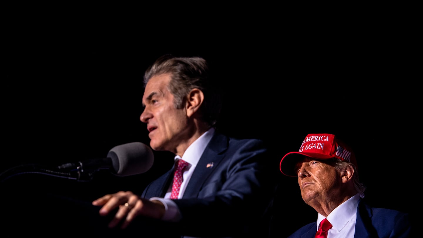 Donald Trump looks on as Dr. Mehmet Oz, the Republican Senate candidate in Pennsylvania, spoke at Trump's fly-in campaign rally in Latrobe, Pa. on Saturday, Nov. 5, 2022.