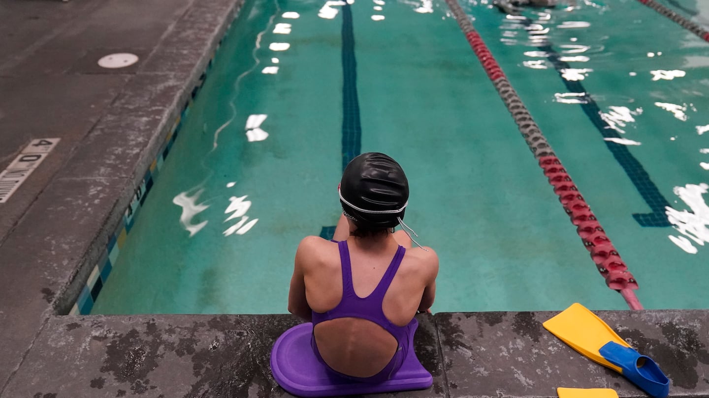 A 12-year-old transgender girl who is a competitive swimmer seen at a pool in Utah in Feb. 2021.