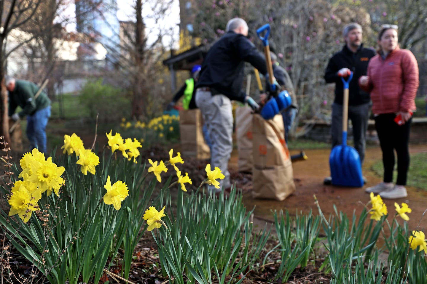 Volunteers participate in a spring clean up of the sensory garden at the Carter School in the South End on April 15, 2022.