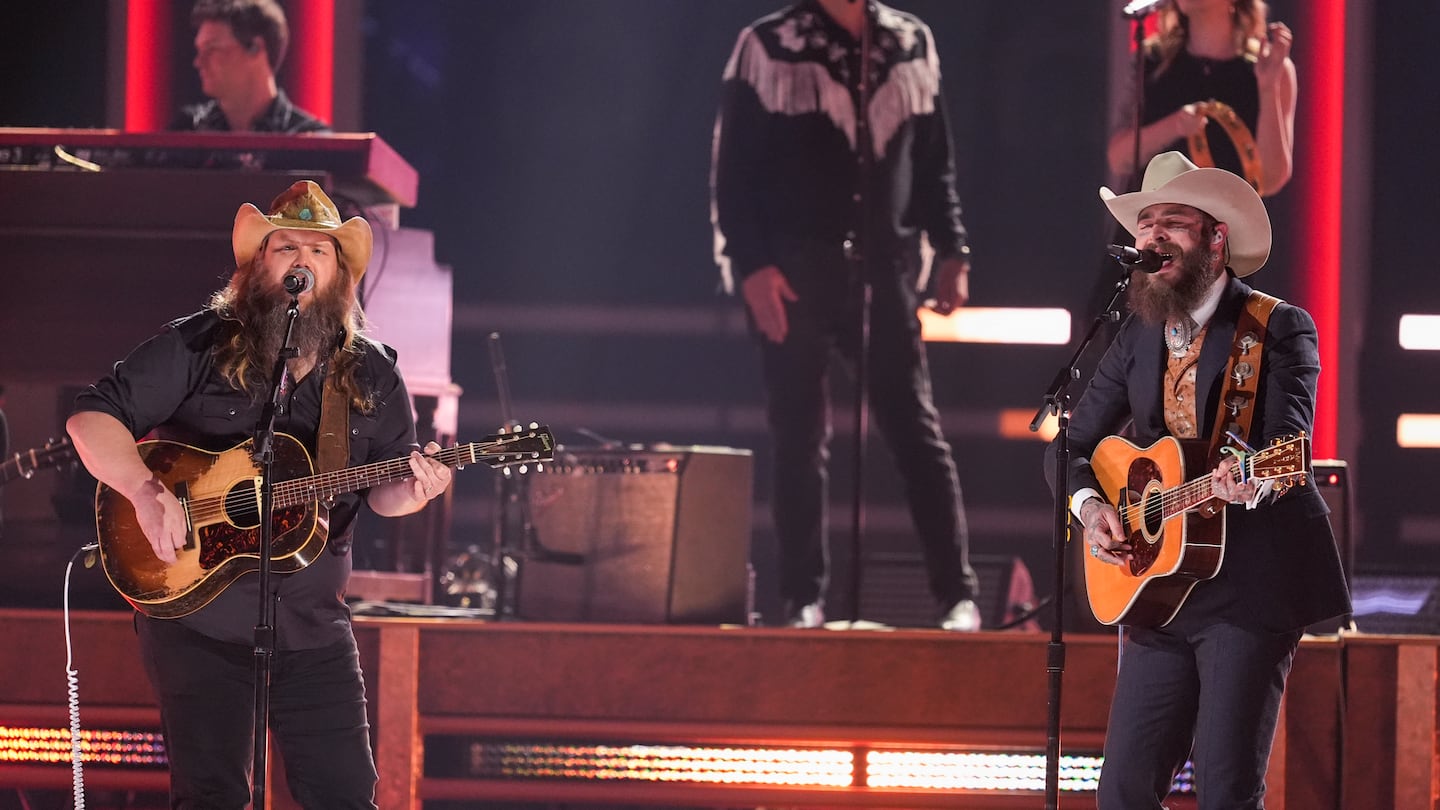 Chris Stapleton, left, and Post Malone perform during the 58th Annual CMA Awards on Nov. 20, at Bridgestone Arena in Nashville, Tenn.