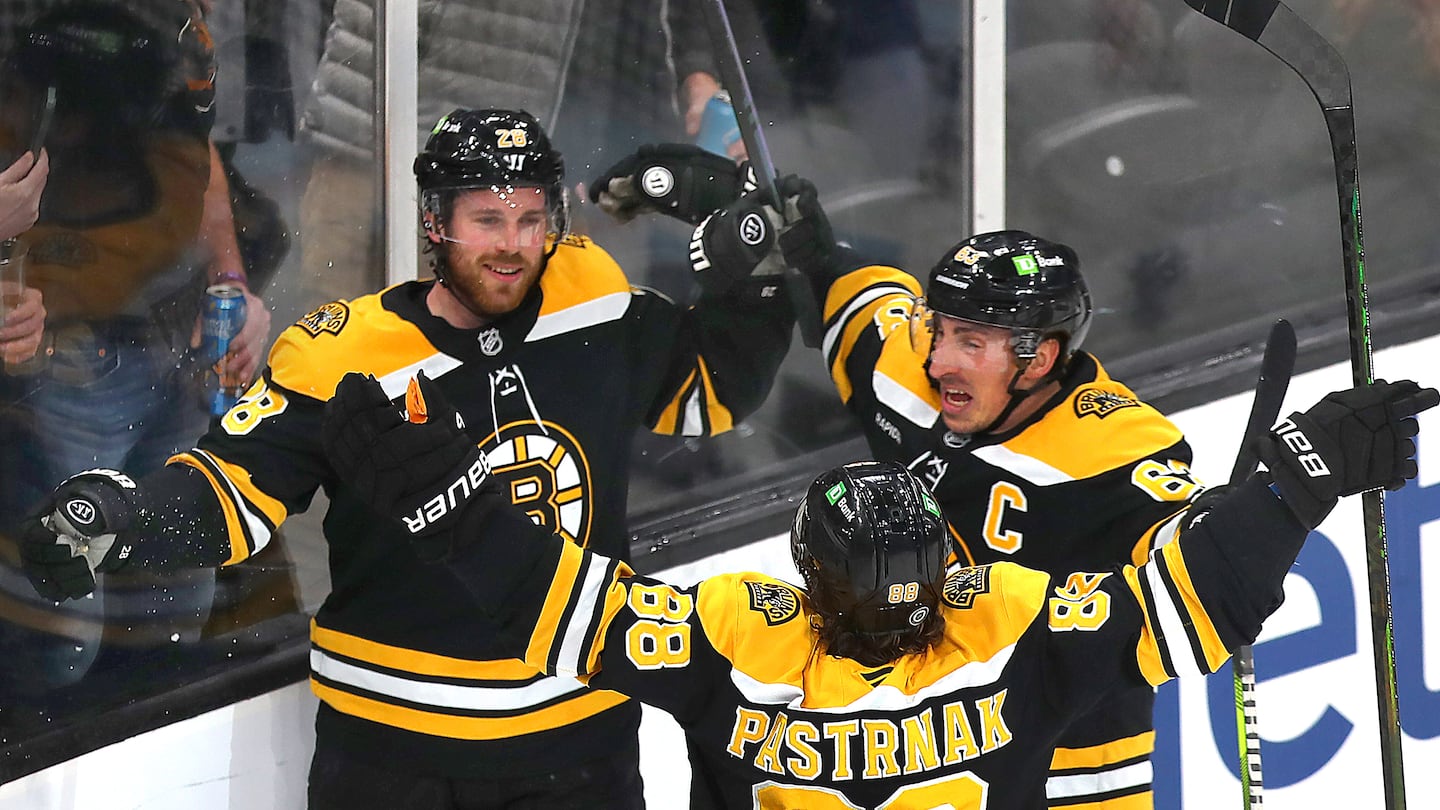 Elias Lindholm (left) ended a 17-game goal drought with a power-play tally in the second period to give the Bruins a 1-0 lead over Utah.