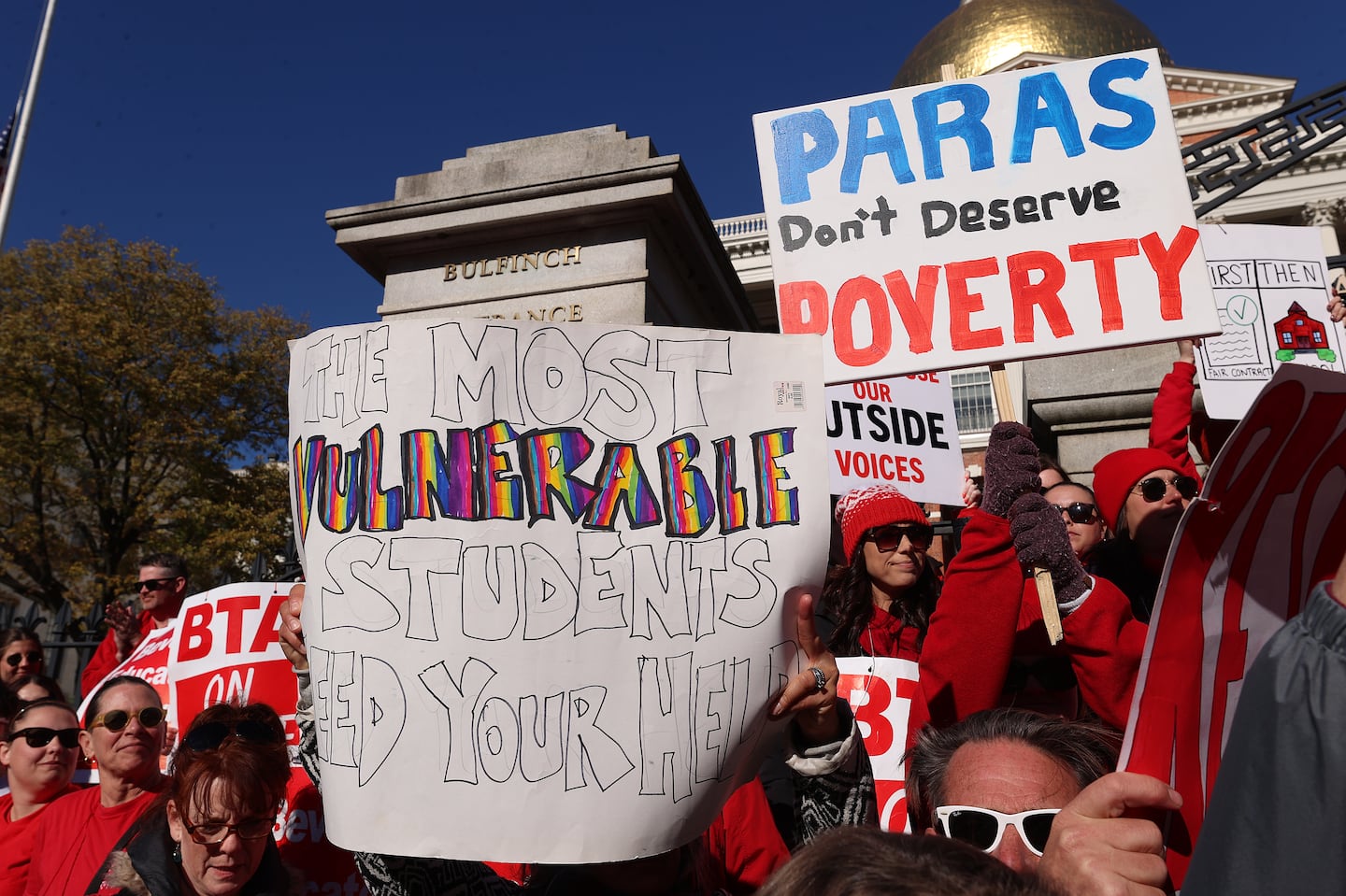 Striking North Shore teachers held a rally at the State House Tuesday and went inside to meet with state officials and walk the hallways of the building.