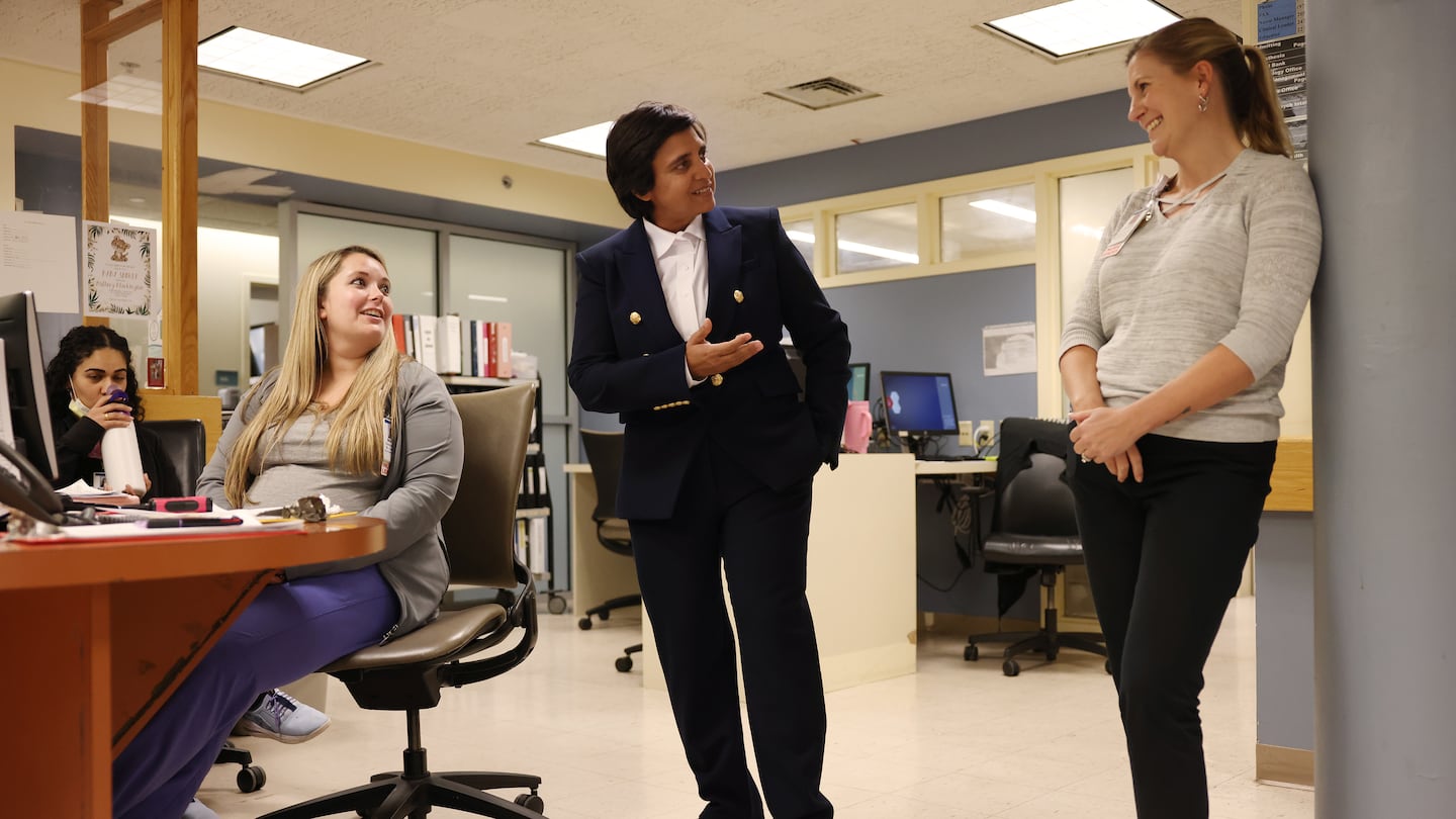 Lawrence General CEO Dr. Abha Agrawal (center) spoke with nurse manager Jennifer Small (right) as she met with staff members at Holy Family Hospital in Methuen on Nov. 7.