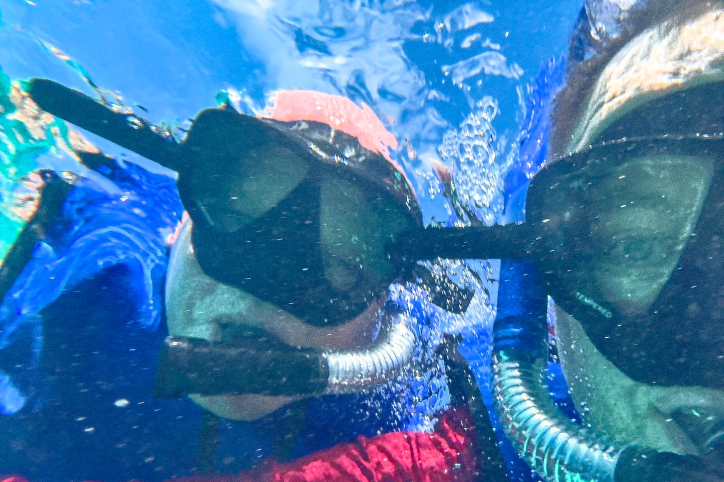 The writer, at right, and his friend Craig pose for a selfie while snorkeling.