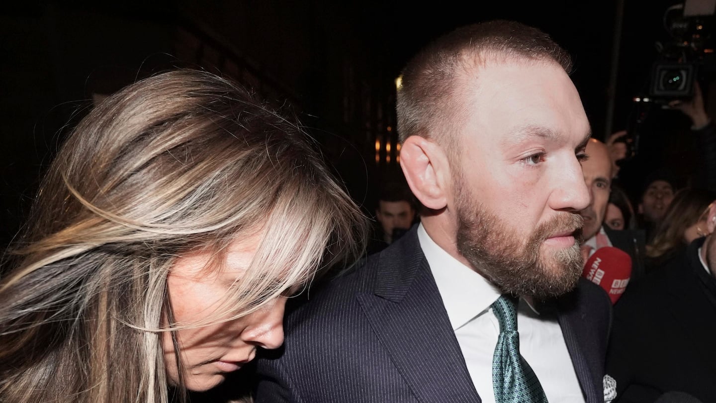 Conor McGregor and partner Dee Devlin leave the High Court in Dublin on Friday after a civil jury found that mixed martial arts fighter sexually assaulted a woman in a hotel penthouse after a night of heavy partying.