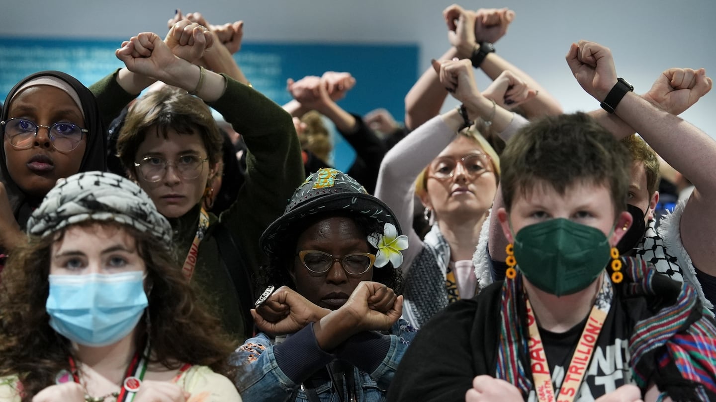 Activists demonstrated in silence protesting a draft of a proposed deal for curbing climate change at the COP29 UN Climate Summit, Friday in Baku, Azerbaijan.