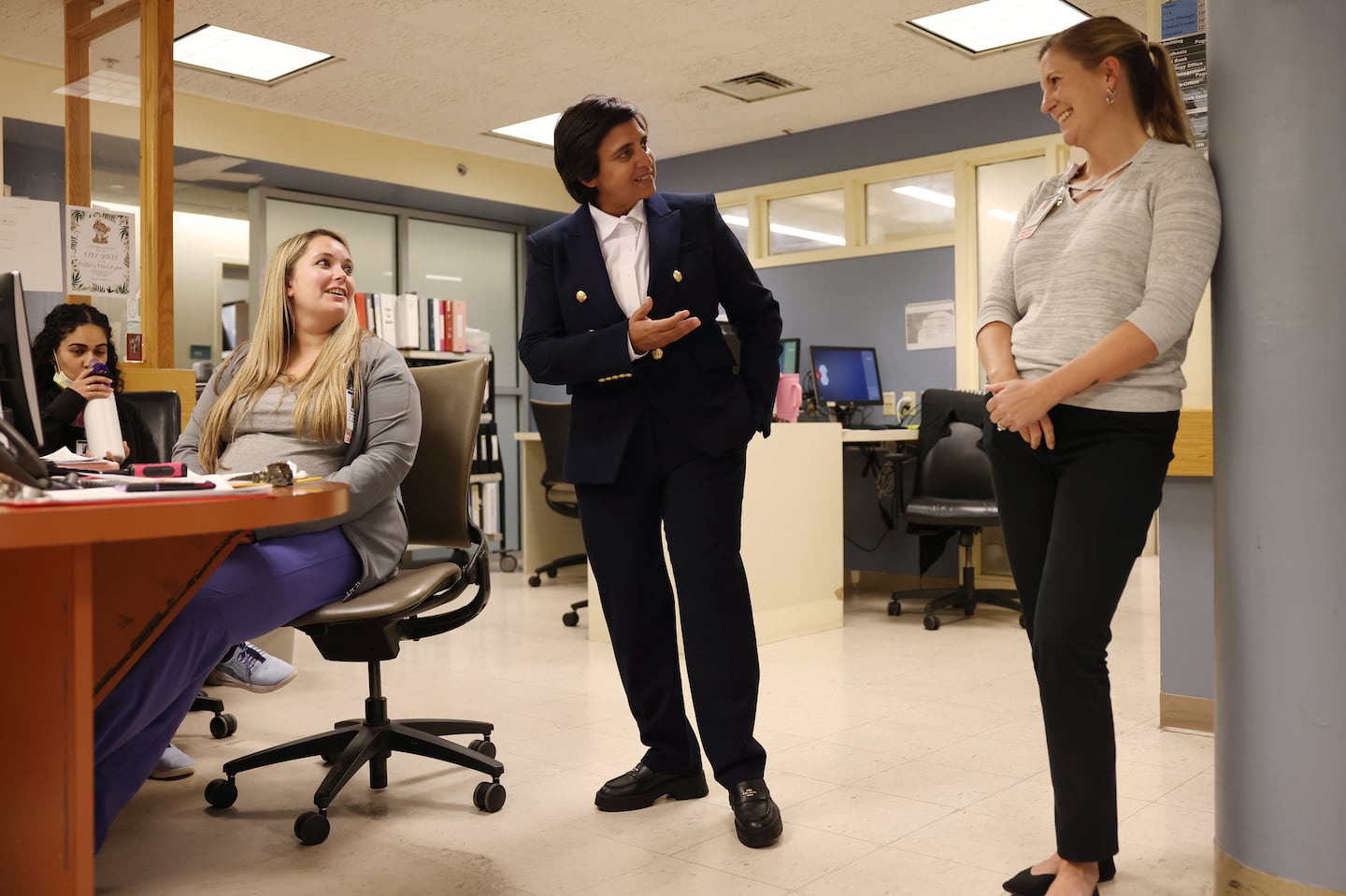 Lawrence General CEO Dr. Abha Agrawal (center) spoke with nurse manager Jennifer Small (right) as she met with staff members at Holy Family Hospital in Methuen on Nov. 7.