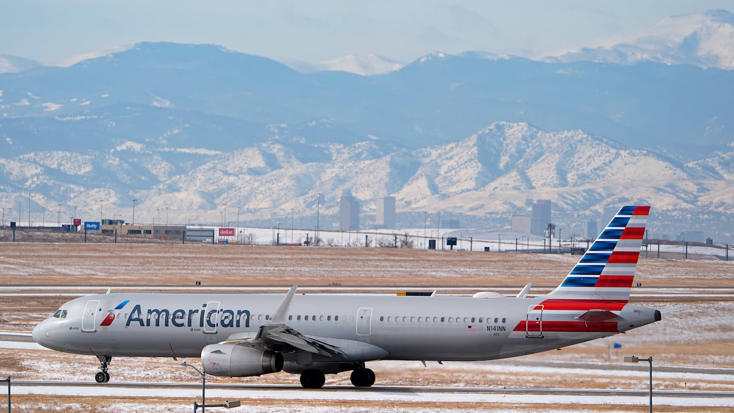 An American Airlines jetliner rumbles down a runway at Denver International Airport on Jan. 16.