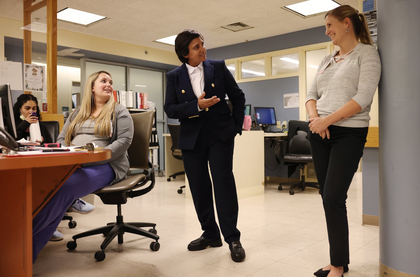 Lawrence General CEO Dr. Abha Agrawal (center) spoke with nurse manager Jennifer Small (right) as she met with staff members at Holy Family Hospital in Methuen on Nov. 7.