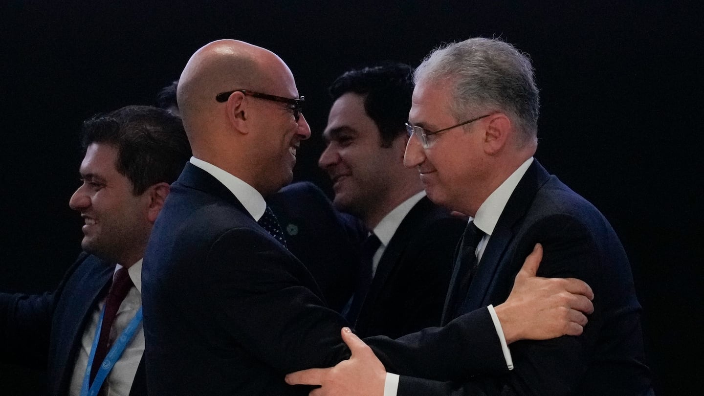 Mukhtar Babayev, COP29 president, (right) embraced Simon Stiell, United Nations climate chief, after reaching a deal for money to curb climate change at the COP29 UN Climate Summit.