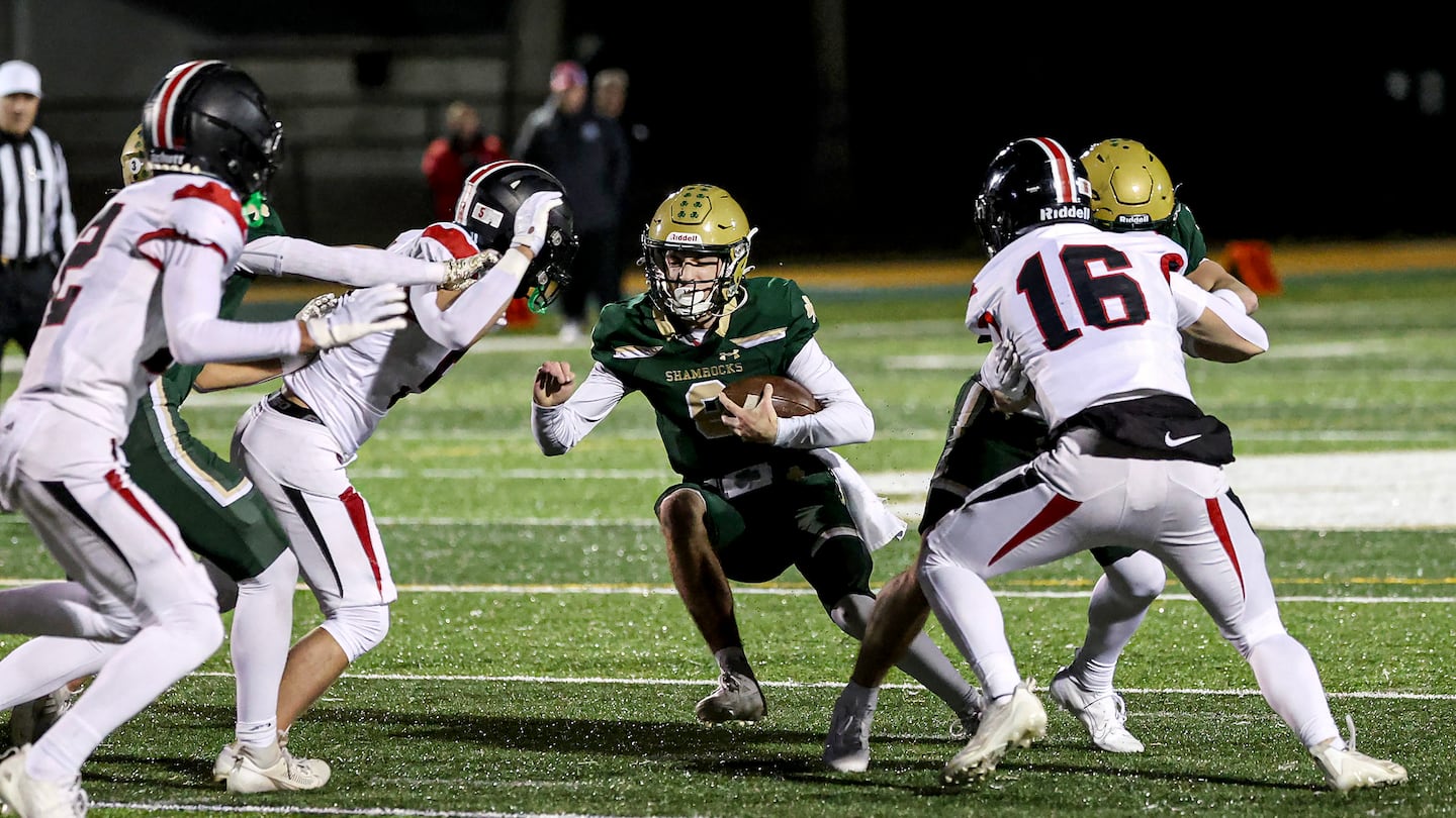 Bishop Feehan quarterback Owen Mordas runs into the Wellesley defense. Wellesley will take on Catholic Memorial in the semifinals.