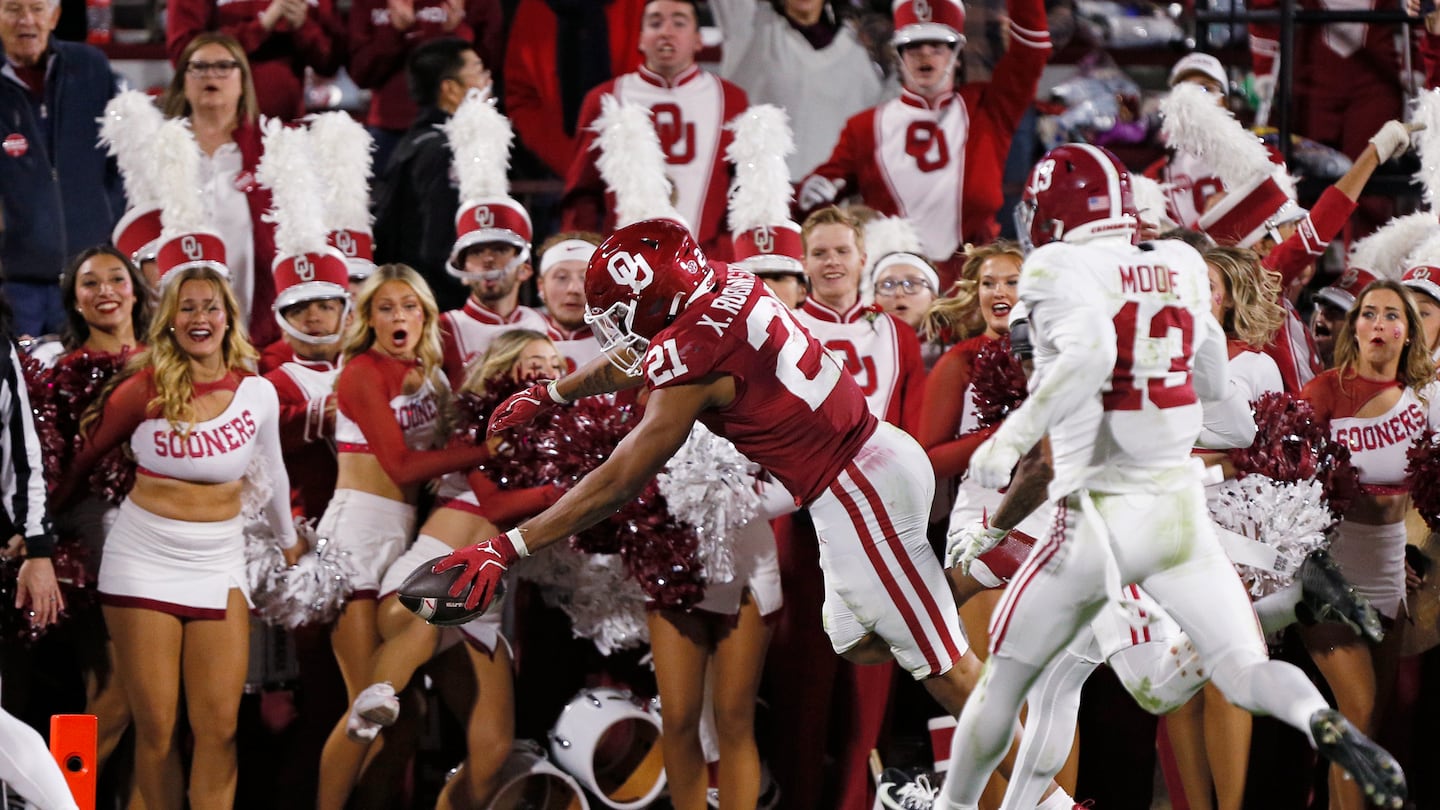 Oklahoma running back Xavier Robinson dives for the end zone to score an 18-yard touchdown to give the Sooners the lead in the second quarter of a 24-3 win over No. 7 Alabama.