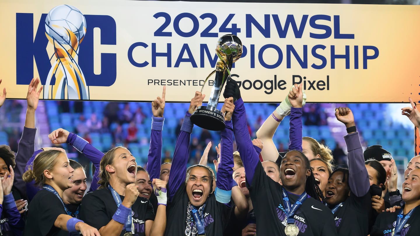 Marta and championship hero Barbra Banda (right) held the NWSL trophy high in Kansas City, Mo.