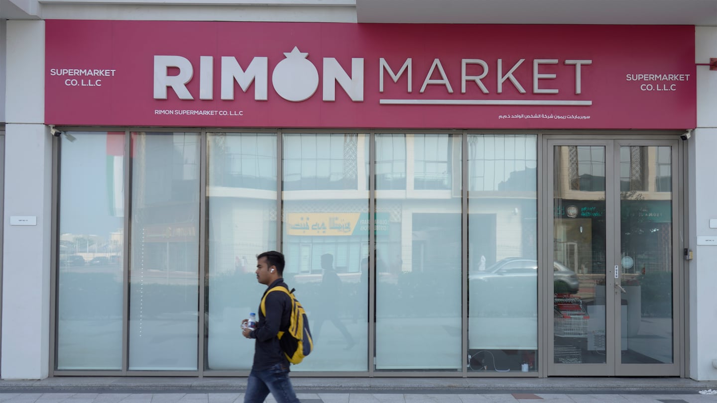 A man walks past Rimon Market, a Kosher grocery store managed by the late Rabbi Zvi Kogan, in Dubai, United Arab Emirates, on Nov. 24.